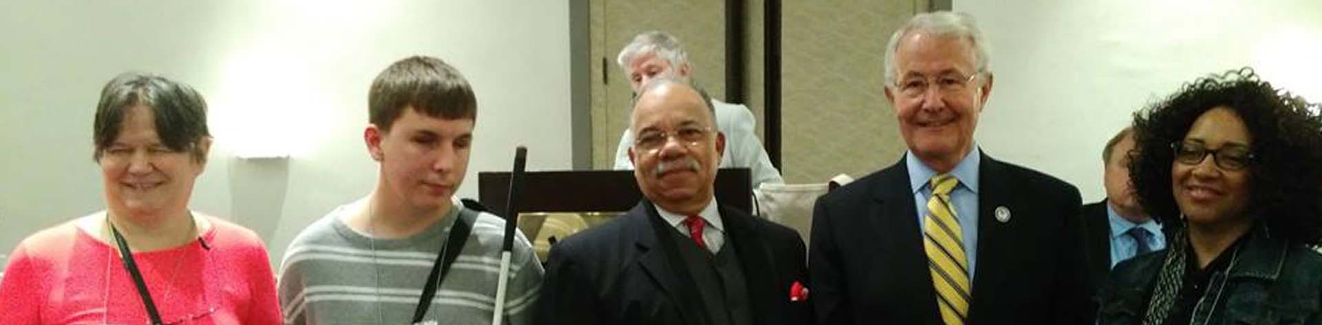 Five NFB of Maryland members who are also veterans smile for a picture